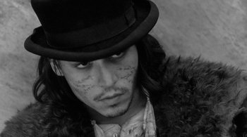 Movie still from “Dead Man” (1995), directed by Jim Jarmusch – A person wearing a hat; Close Up shot, High angle