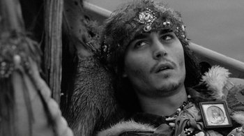 Movie still from “Dead Man” (1995), directed by Jim Jarmusch – A person wearing a headdress; Close Up shot, Low angle