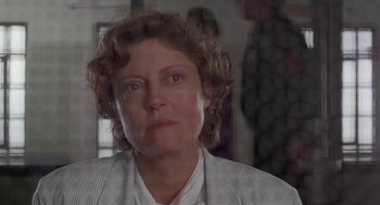 Movie still from “Dead Man Walking” (1995), directed by Tim Robbins – A person wearing a suit; Close Up shot, Over the shoulder angle