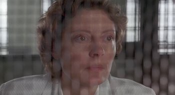 Movie still from “Dead Man Walking” (1995), directed by Tim Robbins – A woman's face through a glass window; Close Up shot, Low angle