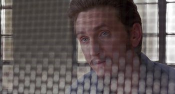 Movie still from “Dead Man Walking” (1995), directed by Tim Robbins – A person looking through a fence; Close Up shot, Low angle