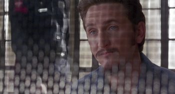 Movie still from “Dead Man Walking” (1995), directed by Tim Robbins – A person looking through a fence; Close Up shot, Low angle
