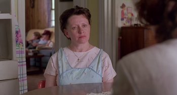 Movie still from “Dead Man Walking” (1995), directed by Tim Robbins – An older woman sitting at a table in front of a mirror; Close Up shot, Over the shoulder angle