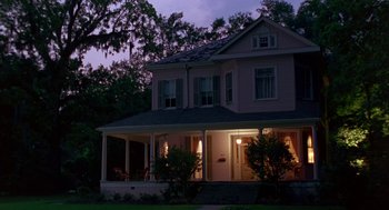 Movie still from “Dead Man Walking” (1995), directed by Tim Robbins – A house that is lit up at night time; Extreme Wide shot, Low angle
