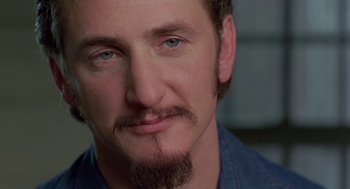 Movie still from “Dead Man Walking” (1995), directed by Tim Robbins – A person with a beard; Close Up shot, Over the shoulder angle