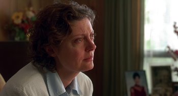 Movie still from “Dead Man Walking” (1995), directed by Tim Robbins – A person sitting in front of a window; Close Up shot, Over the shoulder angle