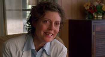 Movie still from “Dead Man Walking” (1995), directed by Tim Robbins – An older woman smiling for the camera; Close Up shot, Low angle