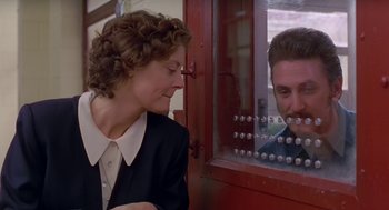 Movie still from “Dead Man Walking” (1995), directed by Tim Robbins – A man and a woman looking at each other through a window; Close Up shot, Over the shoulder angle
