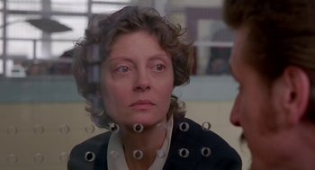Movie still from “Dead Man Walking” (1995), directed by Tim Robbins – An older woman looking in a mirror with eyes drawn on her face; Close Up shot, Over the shoulder angle