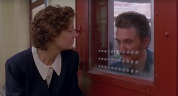 Movie still from “Dead Man Walking” (1995), directed by Tim Robbins – A man and a woman looking at each other through a window; Close Up shot, Over the shoulder angle
