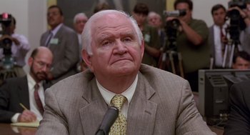 Movie still from “Dead Man Walking” (1995), directed by Tim Robbins – An older man wearing a suit and a tie; Close Up shot, Low angle