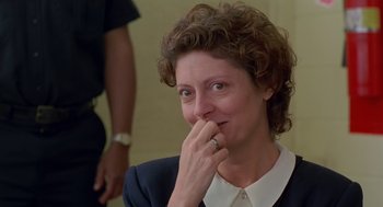 Movie still from “Dead Man Walking” (1995), directed by Tim Robbins – A person sitting with her hand on her face; Close Up shot, Over the shoulder angle