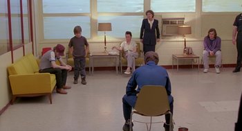 Movie still from “Dead Man Walking” (1995), directed by Tim Robbins – A group of people sitting in a room; Wide shot, High angle
