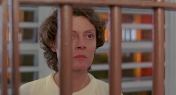 Movie still from “Dead Man Walking” (1995), directed by Tim Robbins – A woman looking through the bars of a jail cell; Close Up shot, Low angle
