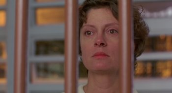 Movie still from “Dead Man Walking” (1995), directed by Tim Robbins – A person behind a fence; Close Up shot, Low angle