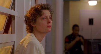 Movie still from “Dead Man Walking” (1995), directed by Tim Robbins – A woman is looking into the distance while a man watches; Close Up shot, Low angle