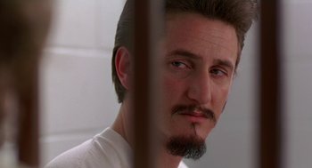 Movie still from “Dead Man Walking” (1995), directed by Tim Robbins – A person with a beard; Close Up shot, Over the shoulder angle