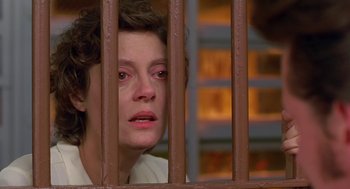 Movie still from “Dead Man Walking” (1995), directed by Tim Robbins – A woman looking through a jail cell bars; Close Up shot, Low angle