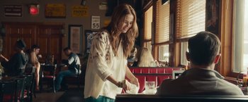 Movie still from “Dirty Grandpa” (2016), directed by Dan Mazer – A woman in a white shirt is washing dishes; Medium shot, Over the shoulder angle