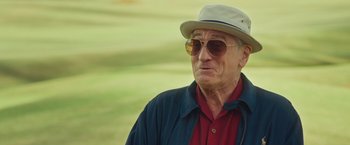 Movie still from “Dirty Grandpa” (2016), directed by Dan Mazer – An older man wearing sunglasses and a hat; Close Up shot, Over the shoulder angle