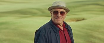 Movie still from “Dirty Grandpa” (2016), directed by Dan Mazer – An older man wearing sunglasses and a hat; Close Up shot, Low angle