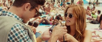 Movie still from “Dirty Grandpa” (2016), directed by Dan Mazer – A man and a woman on the beach taking a picture of each other; Close Up shot, Over the shoulder angle