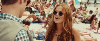 Movie still from “Dirty Grandpa” (2016), directed by Dan Mazer – A woman with long red hair wearing sunglasses; Medium shot, Over the shoulder angle