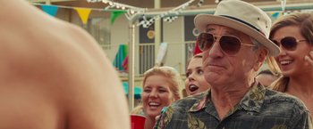 Movie still from “Dirty Grandpa” (2016), directed by Dan Mazer – A group of people standing next to each other at an event; Close Up shot, Over the shoulder angle