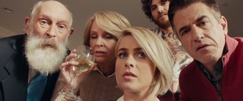 Movie still from “Dirty Grandpa” (2016), directed by Dan Mazer – A group of people standing around each other holding wine glasses; Close Up shot, Over the shoulder angle
