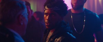 Movie still from “Dirty Grandpa” (2016), directed by Dan Mazer – A person wearing a bandana; Close Up shot, Over the shoulder angle