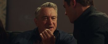 Movie still from “Dirty Grandpa” (2016), directed by Dan Mazer – An older man eating a piece of food with a younger man; Close Up shot, Over the shoulder angle