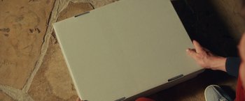 Movie still from “Dirty Grandpa” (2016), directed by Dan Mazer – A person holding a box in their hand; Extreme Close Up shot, Overhead angle