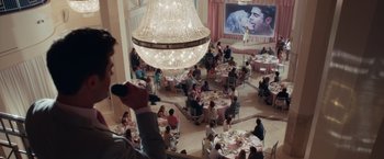 Movie still from “Dirty Grandpa” (2016), directed by Dan Mazer – People are sitting at tables in a large room; Wide shot, Over the shoulder angle
