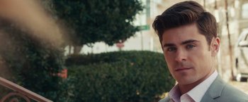 Movie still from “Dirty Grandpa” (2016), directed by Dan Mazer – A young man in a white shirt and a pink tie; Close Up shot, Over the shoulder angle