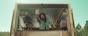 Movie still from “Dirty Grandpa” (2016), directed by Dan Mazer – A man with a beard is standing at a counter; Medium shot, Low angle