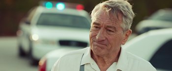 Movie still from “Dirty Grandpa” (2016), directed by Dan Mazer – An older man in a white dress shirt and suspenders; Close Up shot, Over the shoulder angle