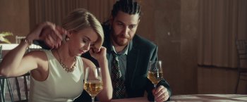 Movie still from “Dirty Grandpa” (2016), directed by Dan Mazer – A man and a woman sitting next to each other at a table with glasses of wine in front of them; Close Up shot, Over the shoulder angle