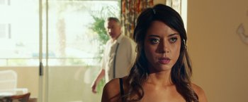 Movie still from “Dirty Grandpa” (2016), directed by Dan Mazer – A woman standing next to a man in a room; Close Up shot, Over the shoulder angle
