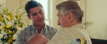 Movie still from “Dirty Grandpa” (2016), directed by Dan Mazer – A man holding a baby next to an older man; Close Up shot, Over the shoulder angle