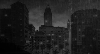 Movie still from “Dead Men Don't Wear Plaid” (1982), directed by Carl Reiner – A black - and - white photo of a city at night; Extreme Wide shot, High angle
