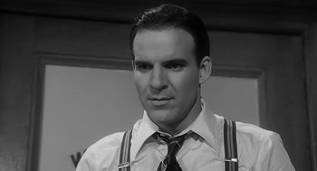 Movie still from “Dead Men Don't Wear Plaid” (1982), directed by Carl Reiner – Black and white photograph of a man wearing a tie and suspenders; Close Up shot, Low angle