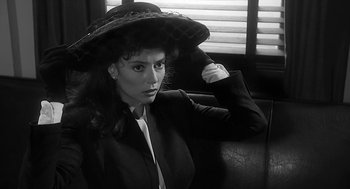 Movie still from “Dead Men Don't Wear Plaid” (1982), directed by Carl Reiner – A black and white photo of a woman with a hat; Close Up shot, High angle