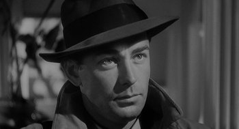 Movie still from “Dead Men Don't Wear Plaid” (1982), directed by Carl Reiner – A black and white photo of a man wearing a hat; Close Up shot, Low angle