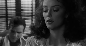 Movie still from “Dead Men Don't Wear Plaid” (1982), directed by Carl Reiner – A black - and - white photo of a woman with long hair; Close Up shot, Over the shoulder angle