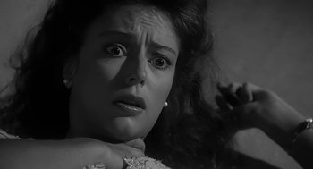 Movie still from “Dead Men Don't Wear Plaid” (1982), directed by Carl Reiner – A woman's face in black - and - white photo; Close Up shot, Low angle