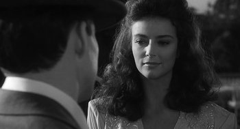 Movie still from “Dead Men Don't Wear Plaid” (1982), directed by Carl Reiner – A man and a woman talking to each other; Close Up shot, Over the shoulder angle