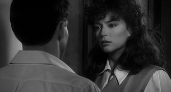 Movie still from “Dead Men Don't Wear Plaid” (1982), directed by Carl Reiner – A man and a woman looking at each other in a mirror; Close Up shot, Over the shoulder angle