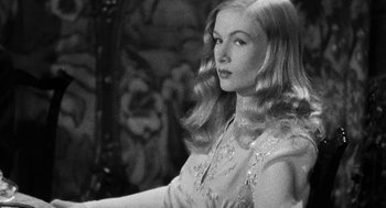 Movie still from “Dead Men Don't Wear Plaid” (1982), directed by Carl Reiner – A black and white photo of a woman with long blonde hair; Close Up shot, Over the shoulder angle