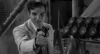 Movie still from “Dead Men Don't Wear Plaid” (1982), directed by Carl Reiner – A black and white photo of a man holding a gun; Close Up shot, Over the shoulder angle