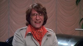 Movie still from “Death Race 2000” (1975), directed by Paul Bartel – A man wearing glasses and a red bandana; Close Up shot, Low angle